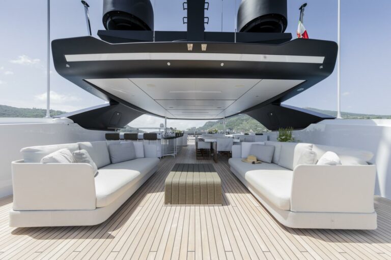 Flybridge cooles yacht ever SEVEN SINS spacious deck for charter loung and dining white and grey design