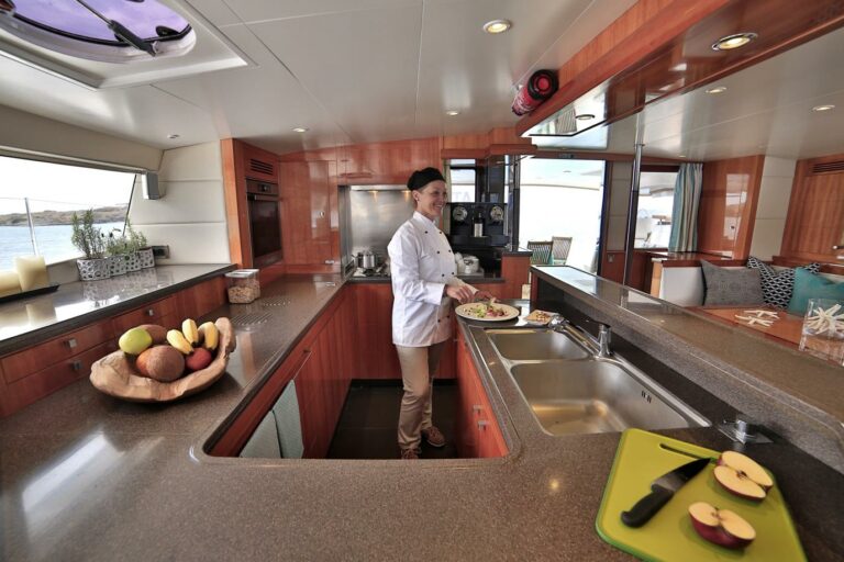 Great food coming from chef cook in spacious galley of catamaran on top deck on WORLDS END Charter yacht