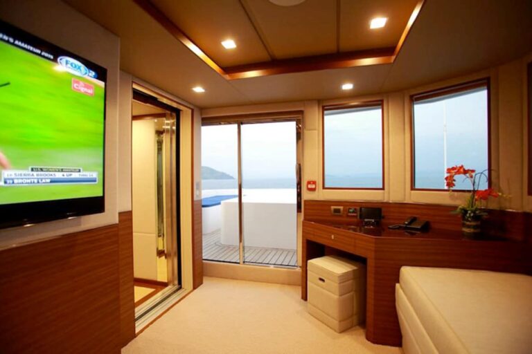 Owner’s Lounge with elevator left and private terrace behind