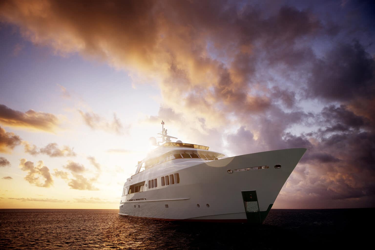 Yacht In Sea Against Sky During Sunset